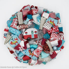 The Camper Holiday Wreath is made with bright and festive winter inspired ribbon.  No matter how cold it is outside people will smile when they see this Fun Winter Wreath.